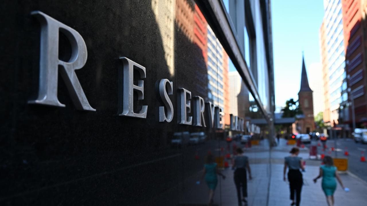 People walk past the Reserve Bank of Australia