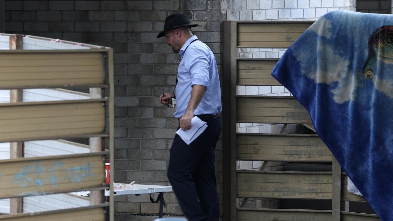 Police work at the scene of a fatal stabbing in Malak, Darwin