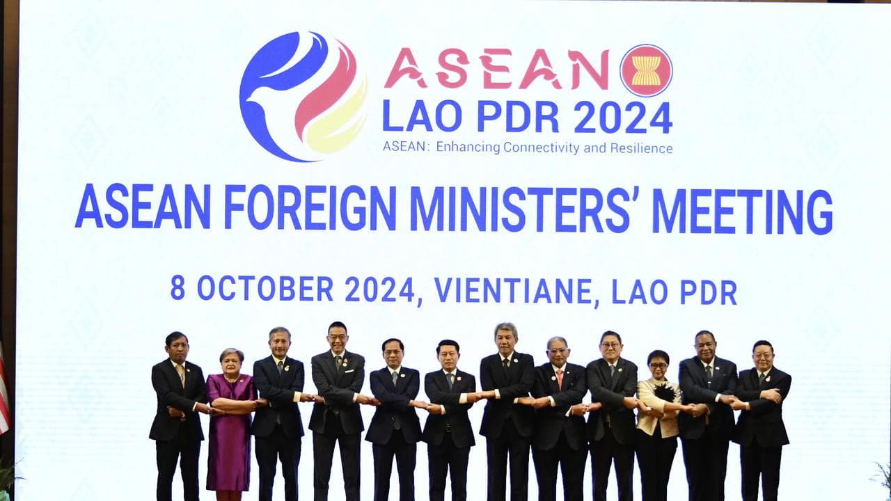 ASEAN foreign ministers do the bloc's handshake