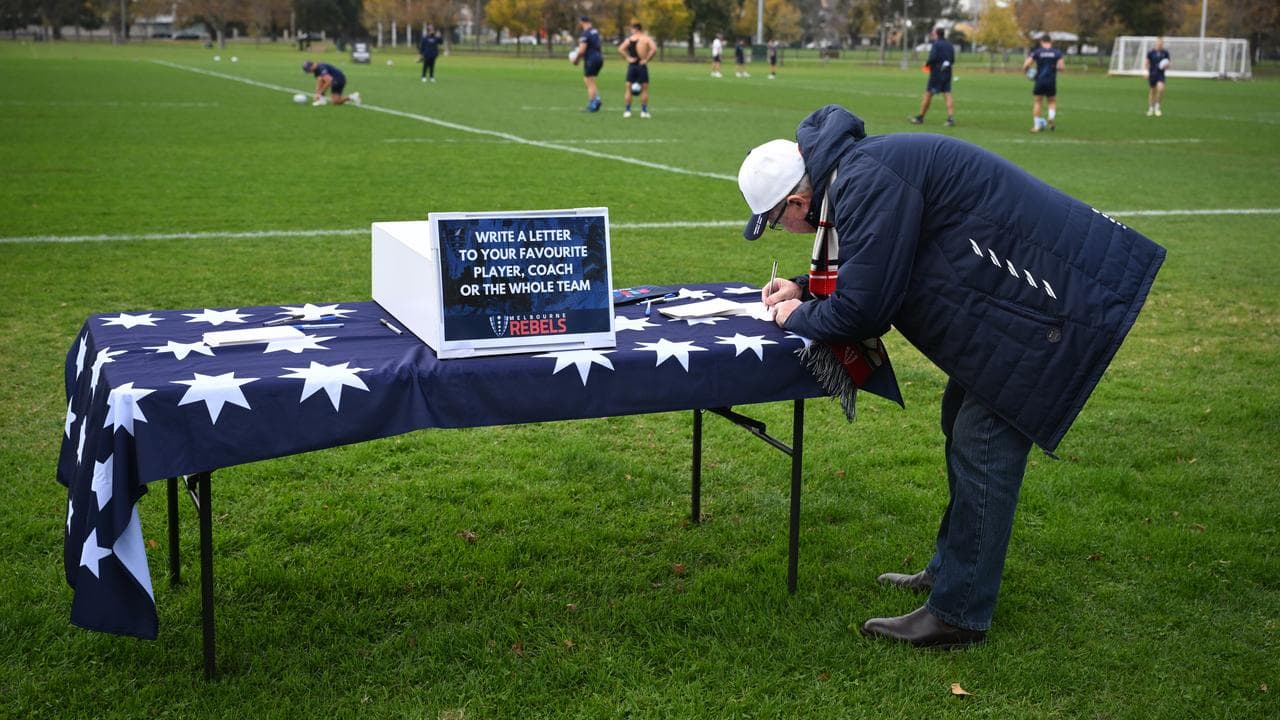 A fan writing a letter of support to the Rebels (file image)