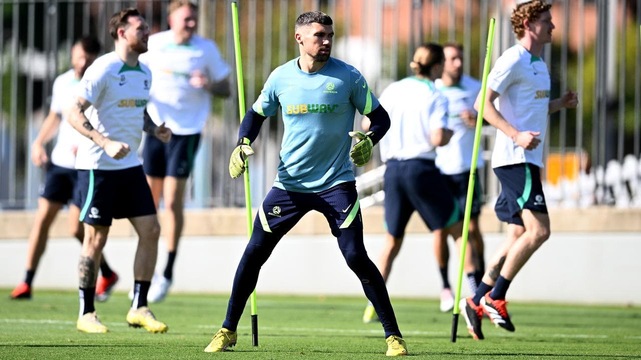 Socceroos captain Maty Ryan (centre).