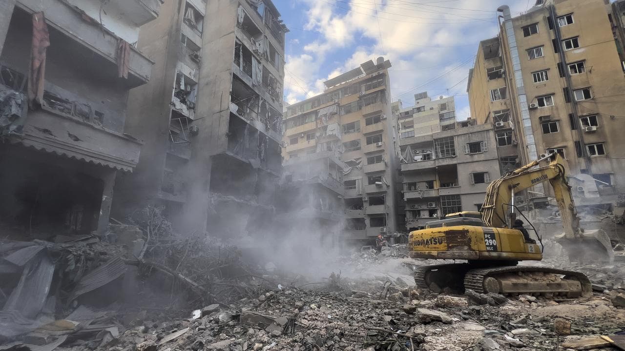 Excavator in the search for victims of an air strike in central Beirut
