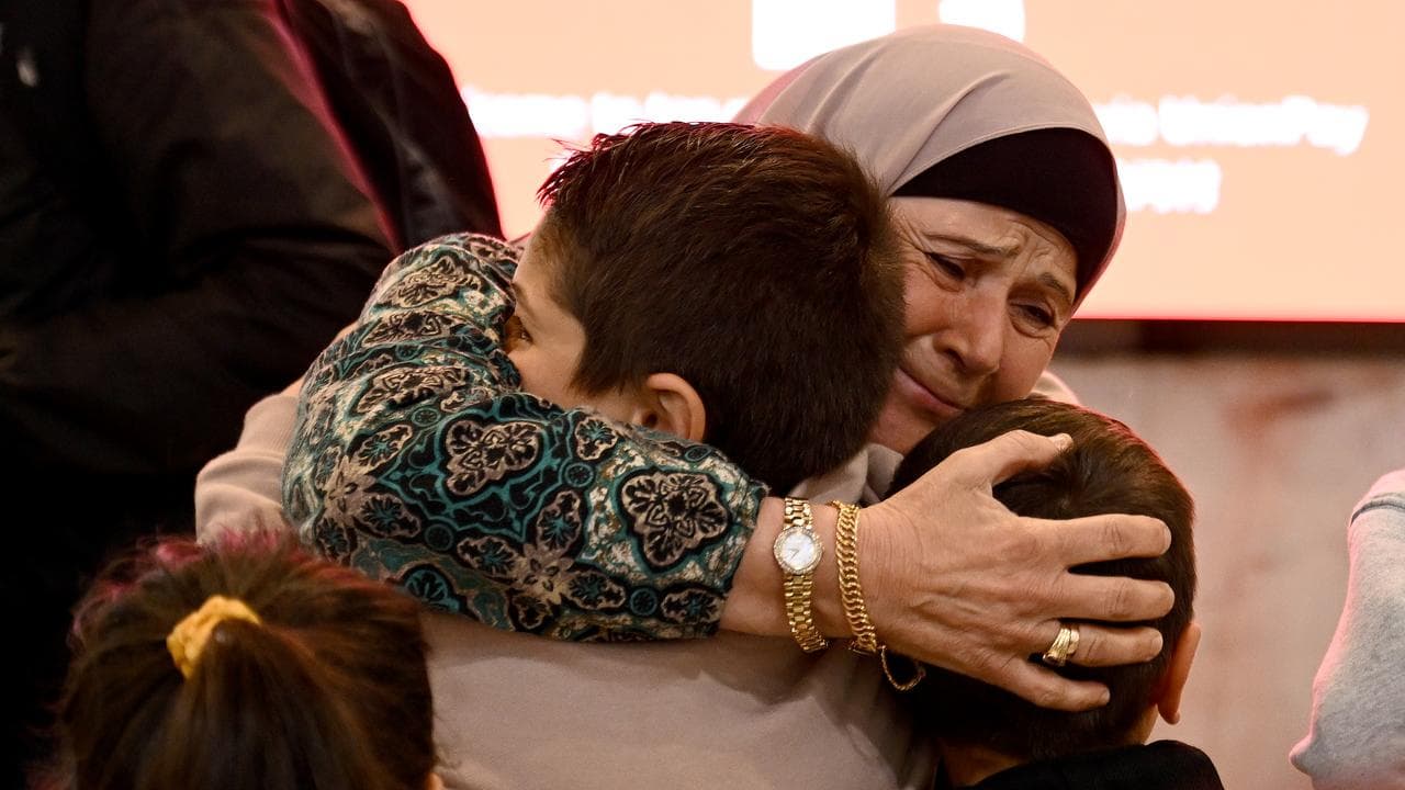 Australian nationals arrive at Sydney International Airport in Sydney