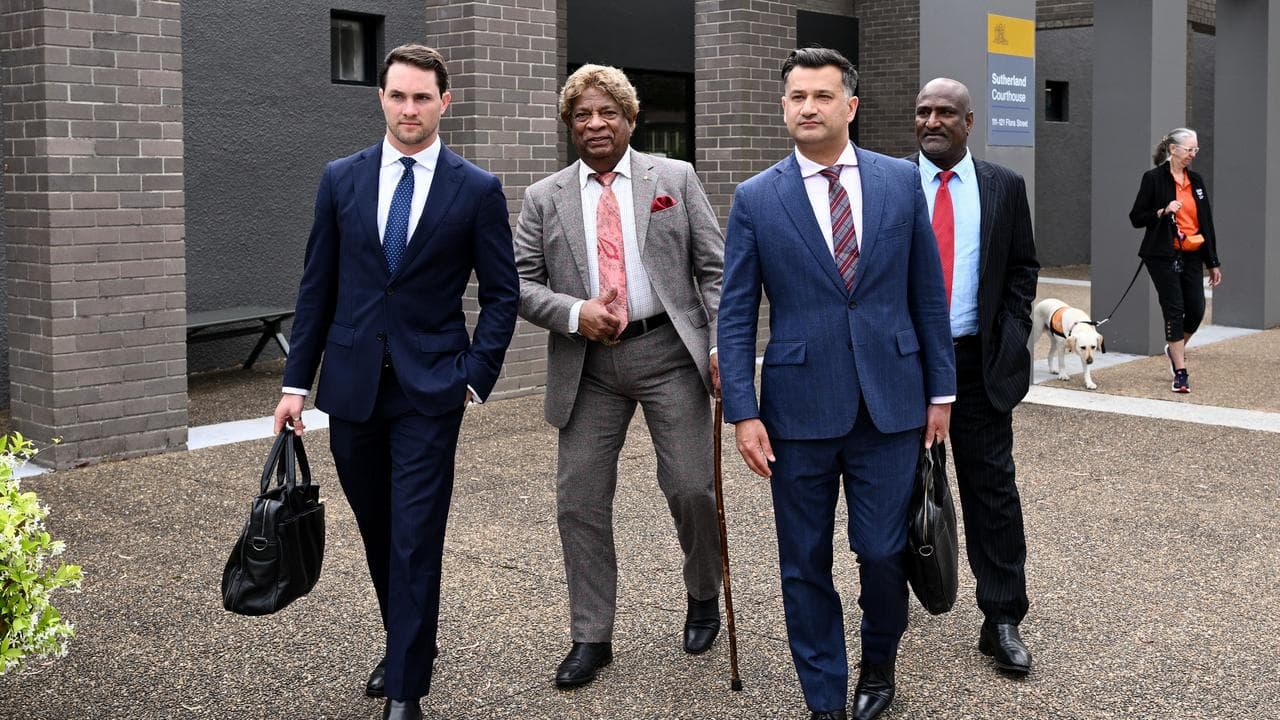 Kandiah Kamalesvaran, better known by his stage name Kamahl (centre)