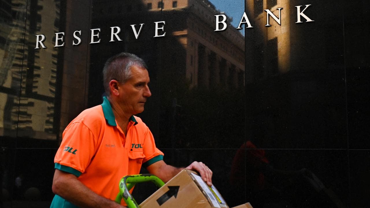 A person walks past the RBA building in Sydney (file image)