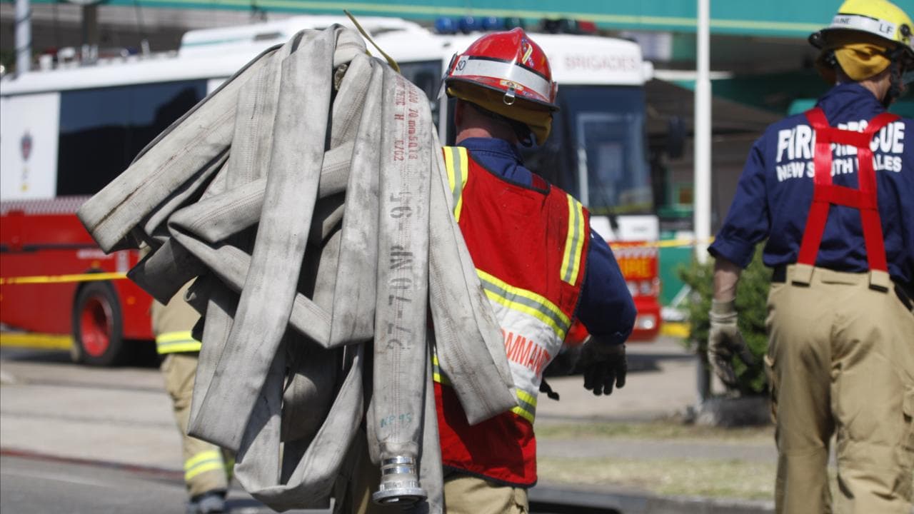 Firefighters at a scene of a fire in Sydney's west