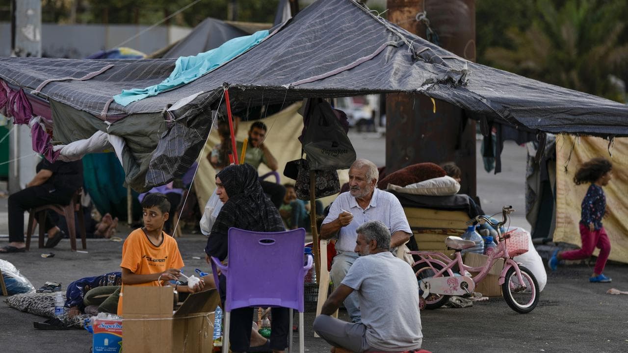 File photo of families in Beirut after fleeing Israeli strikes