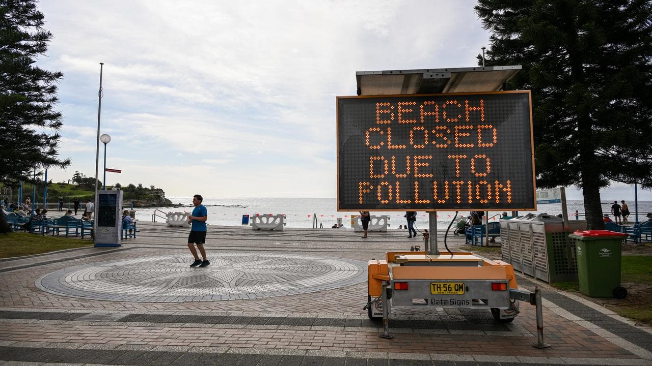Beach closed signs at Coogee Beach.