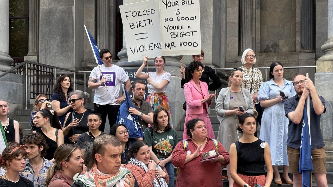 Protesters on the steps of parliament ahead of the vote.