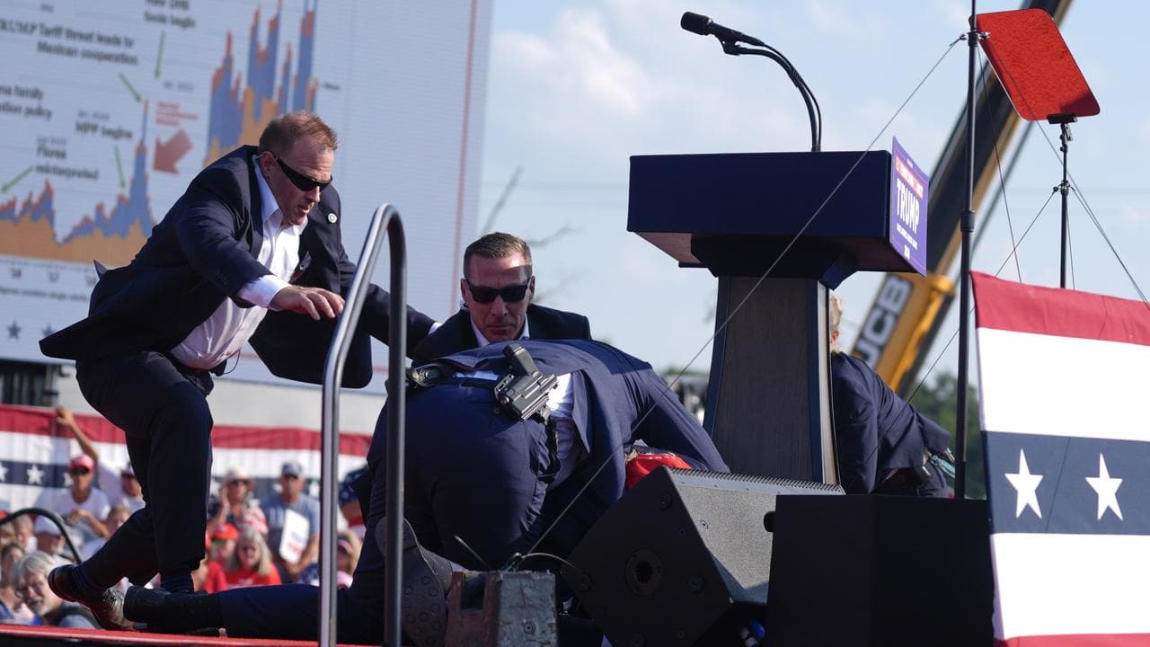 Secret Service agents cover Donald Trump in Butler, Pennsylvania