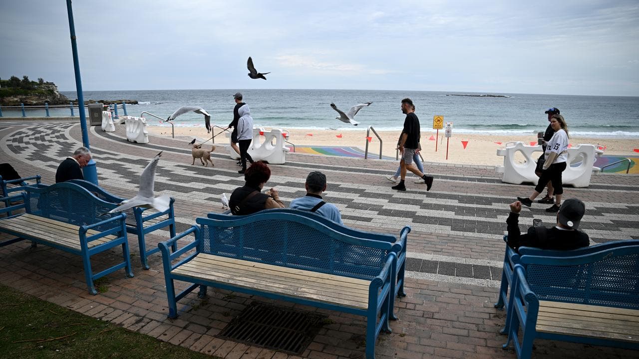 People along the esplanade at Coogee Beach