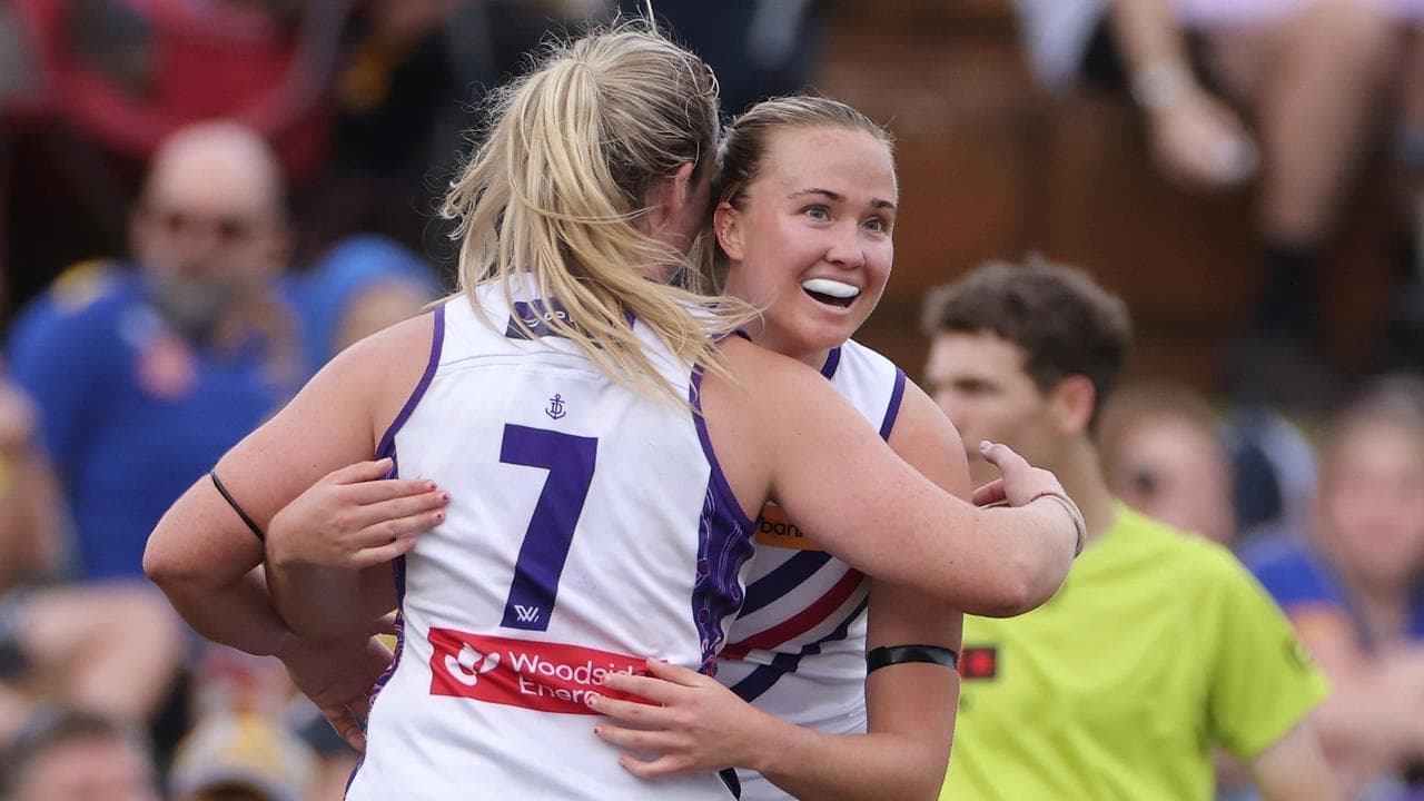 Gabby Biedenweg-Webster (right) is congratulated by Aisling McCarthy.