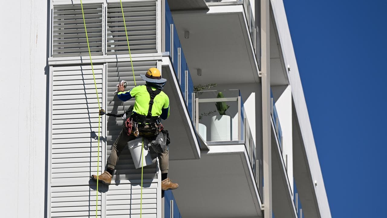 Rope access construction worker