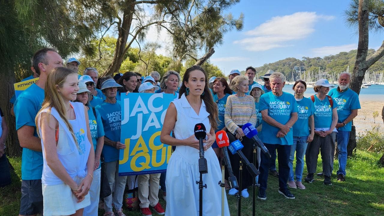 Jacqui Struby addresses media in front of supporters at Bayview