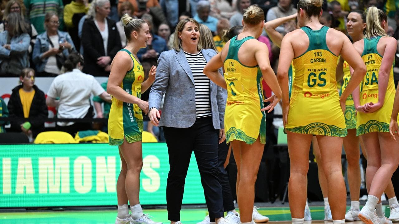 Coach Stacey Marinkovich (second left).