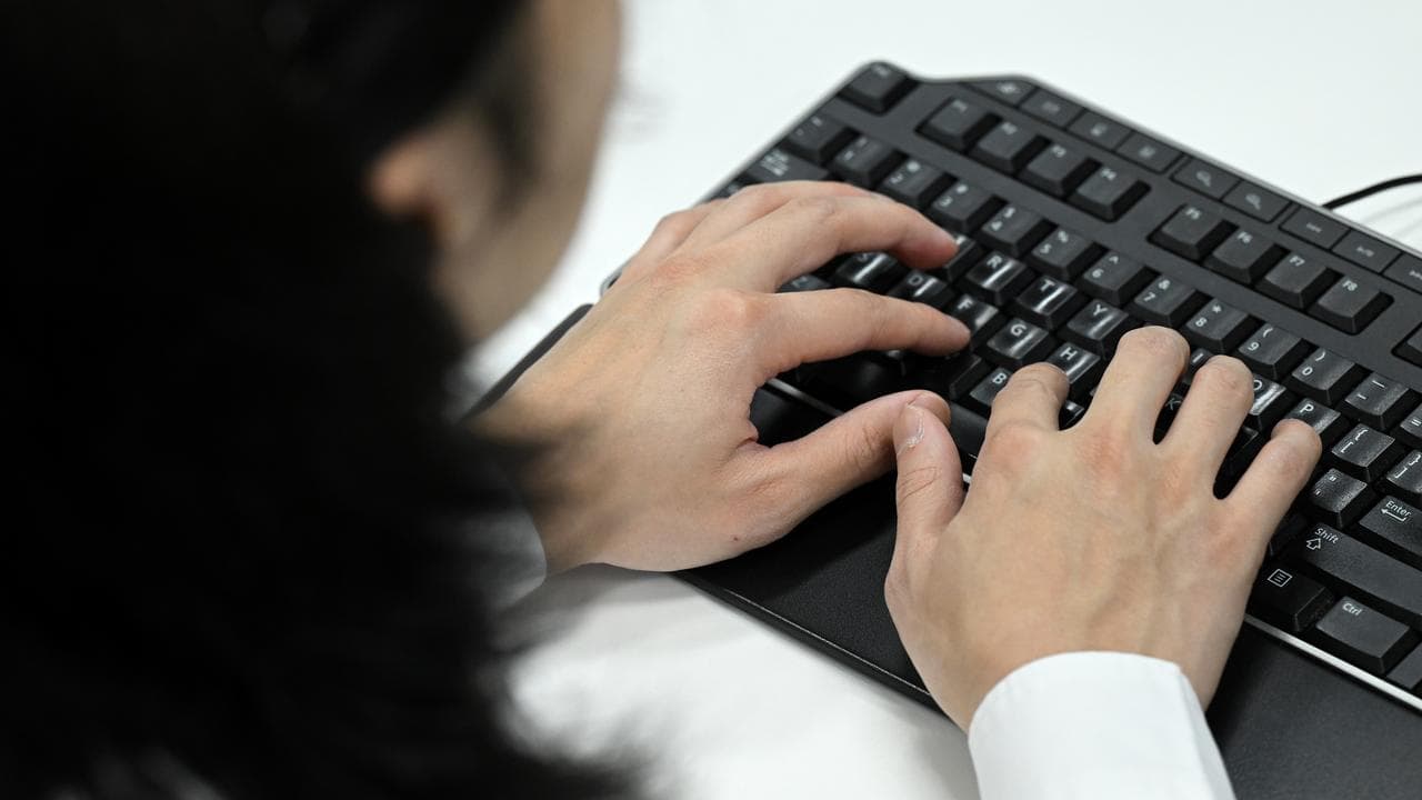 A person typing on a keyboard (file image)