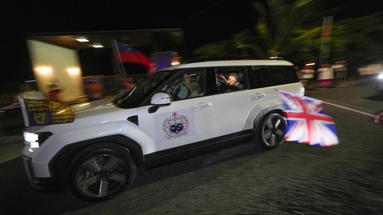 King Charles and Queen Camilla wave to wellwishers in Samoa