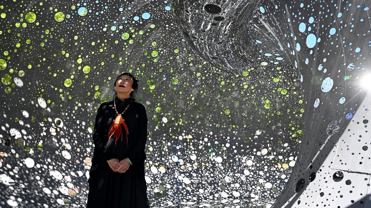 Artist Lindy Lee inside the Ouroboros sculpture