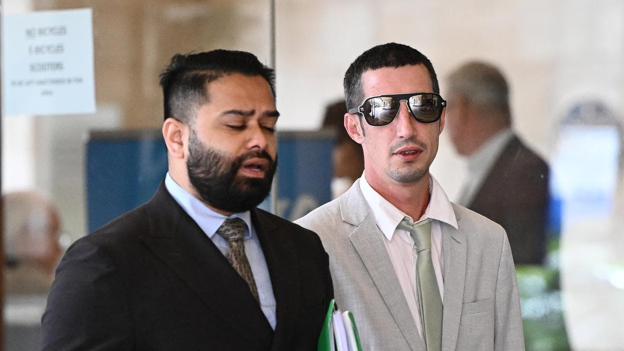 Ryan Marshall (right) arrives at Downing Centre Local Court 