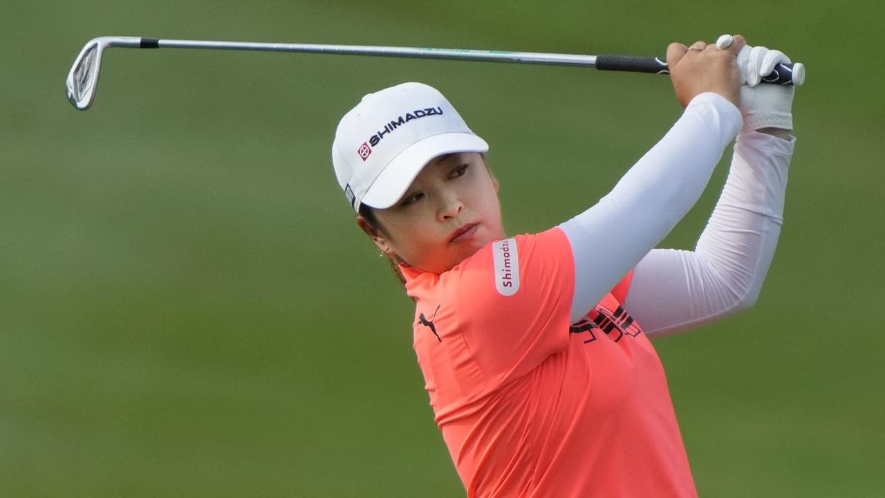 Japan's Mao Saigo follows the flight of her ball on the third fairway.