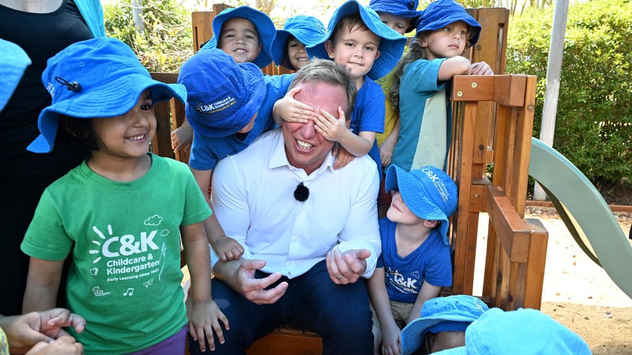Queensland Premier Steven Miles is seen interacting with children