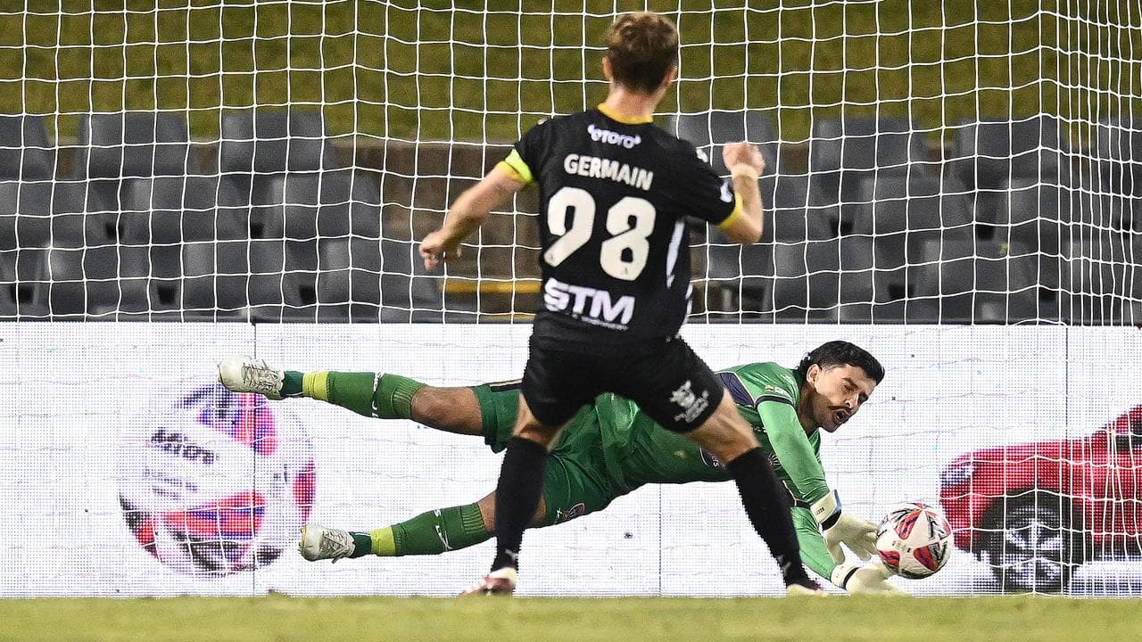 Ryan Scott saves Ryan Germain's penalty attempt.