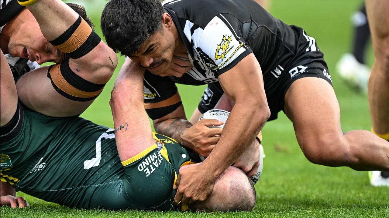 Dylan Edwards tackles Matthew Timoko.