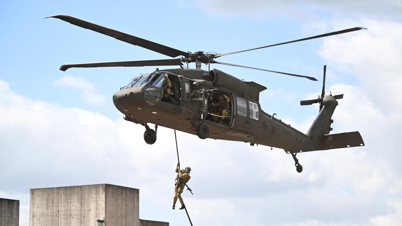 ADF members and Black Hawk participate in a mock hostage rescue