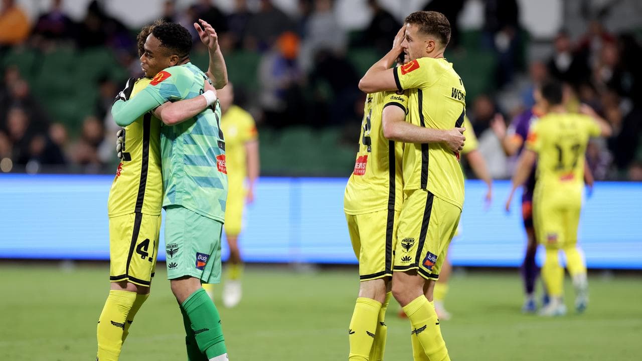 Wellington Phoenix players celebrate.