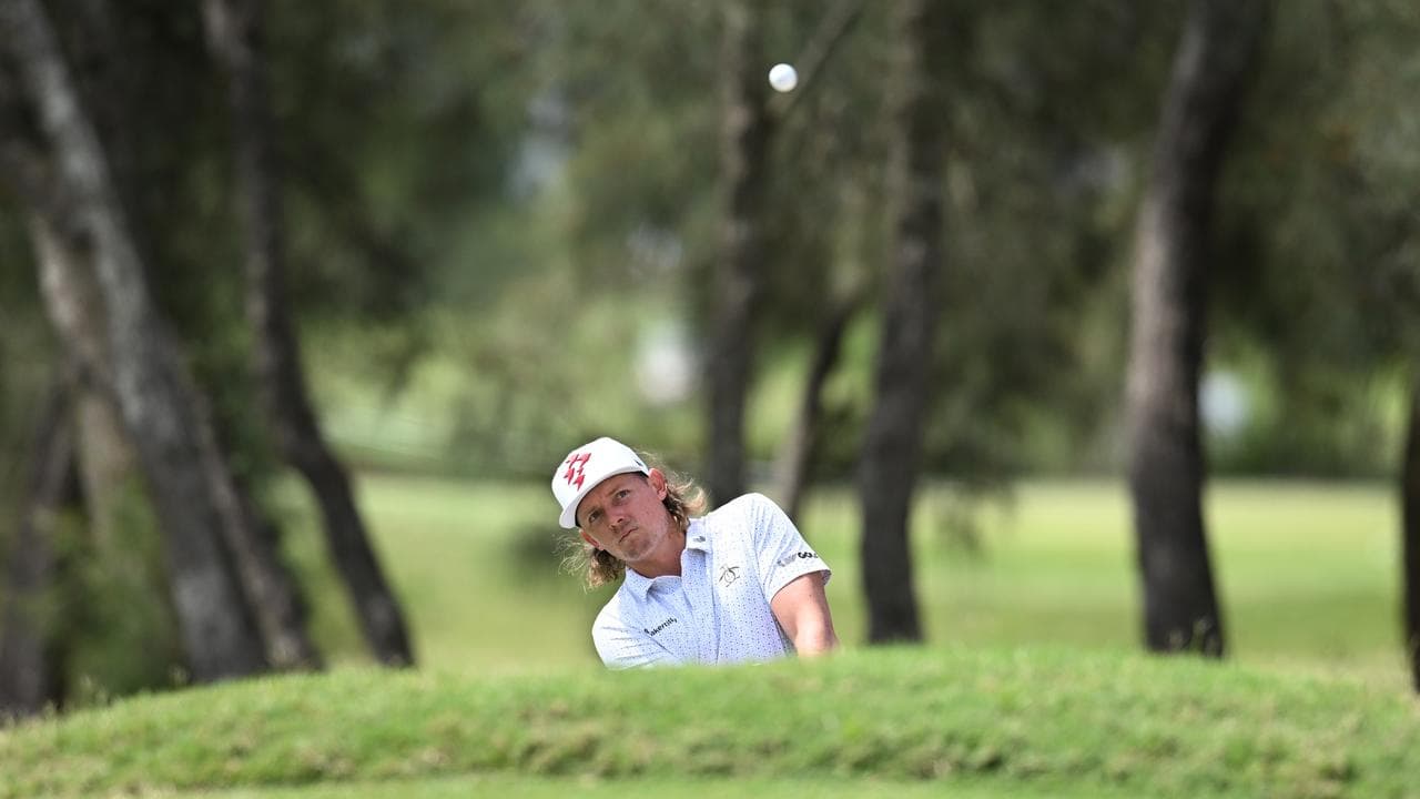 Cameron Smith watches his approach shot.