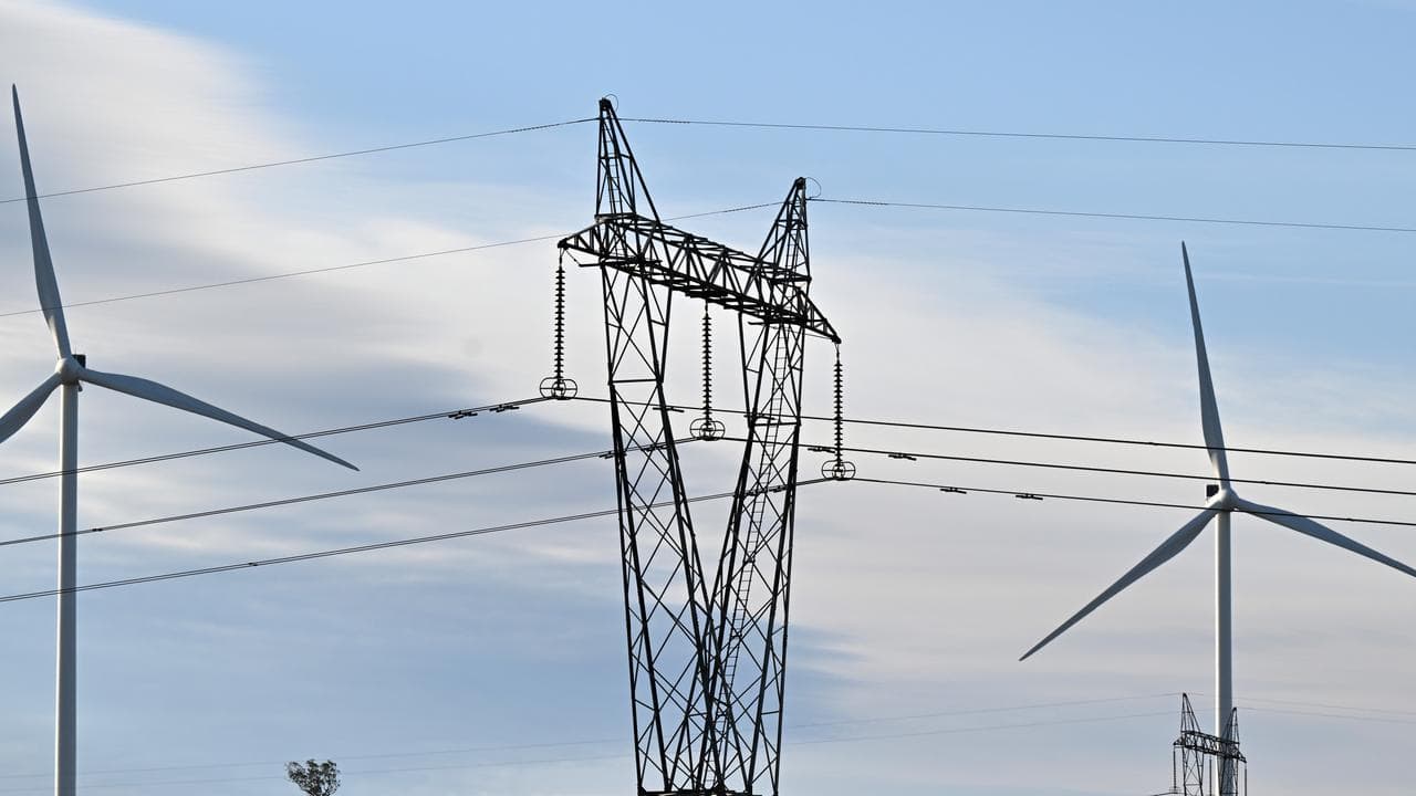 Power-generating windmill turbines and electricity pylons