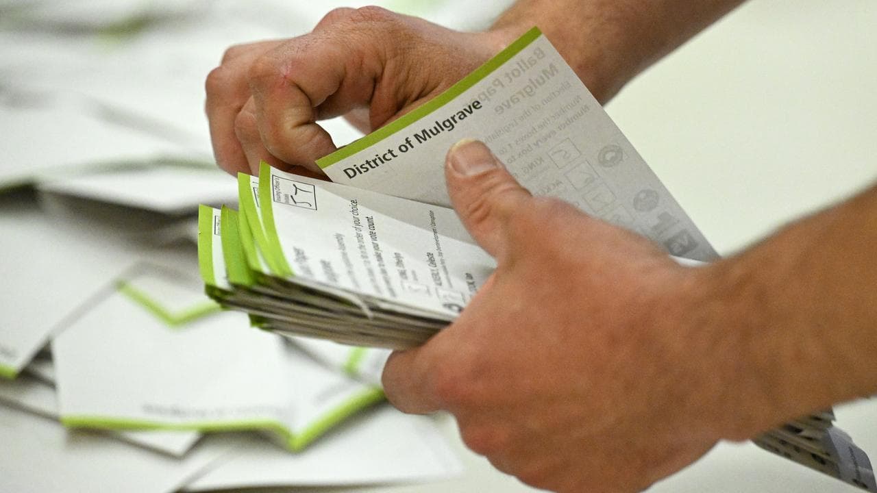 A Victorian Electoral Commission official sorts ballot papers