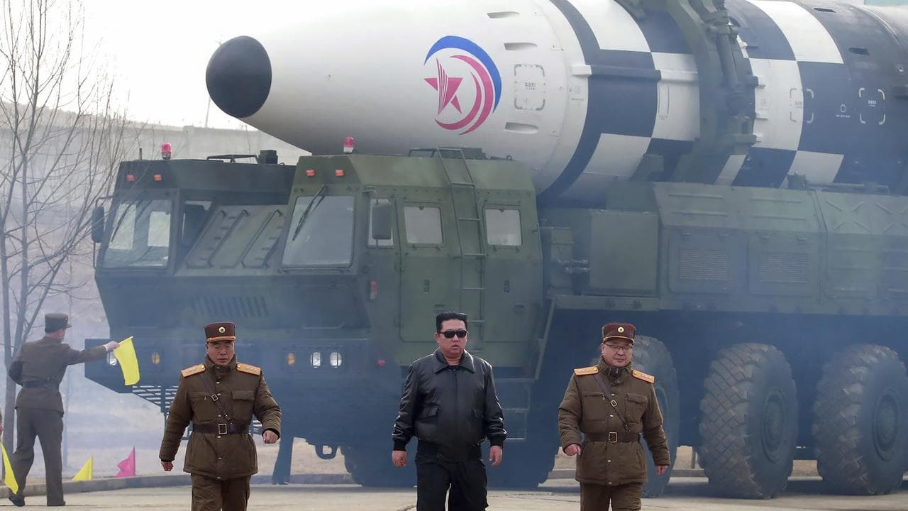 North Korean leader Kim Jong-un in front of an ICBM
