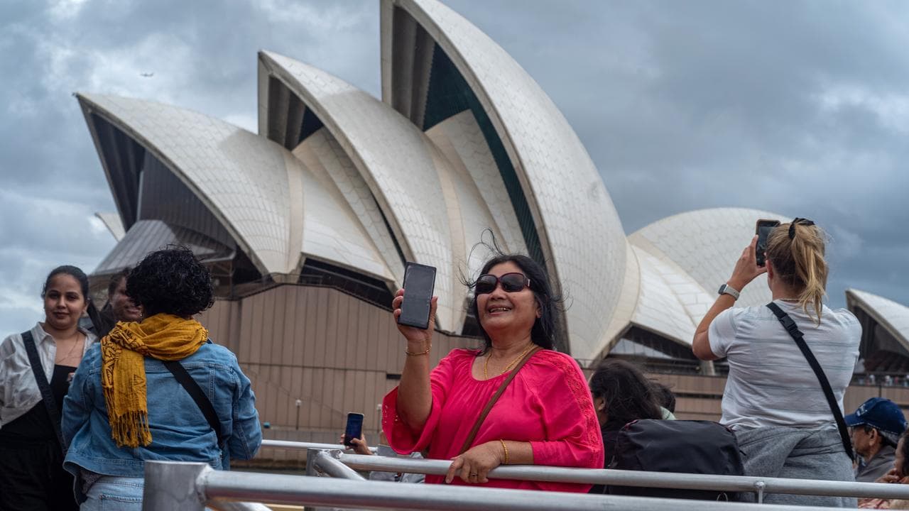 Tourists outside the Sydney Opera House
