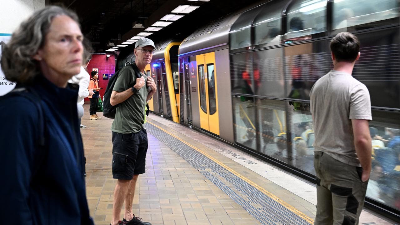 Commuters are seen at Martin Place