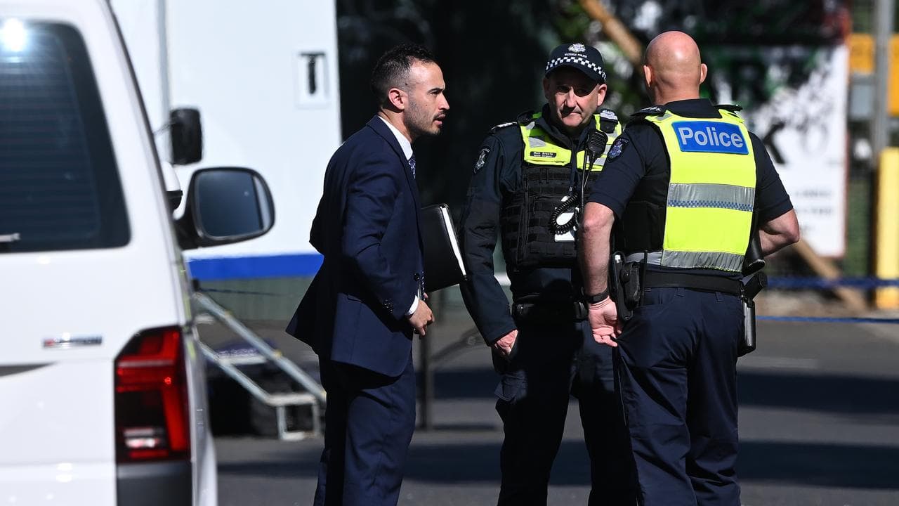 Victoria Police at the crime scene in North Melbourne