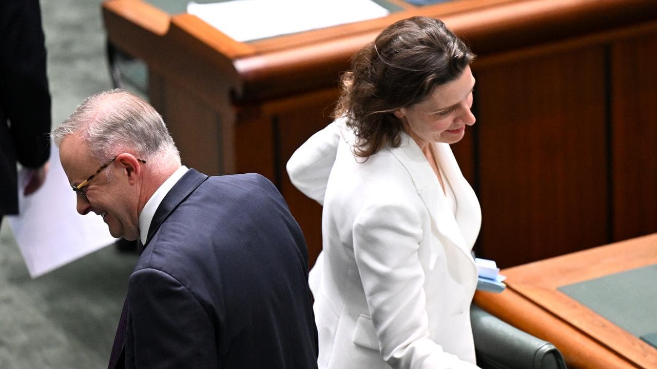 Allegra Spender walks past Australian Prime Minister Anthony Albanese