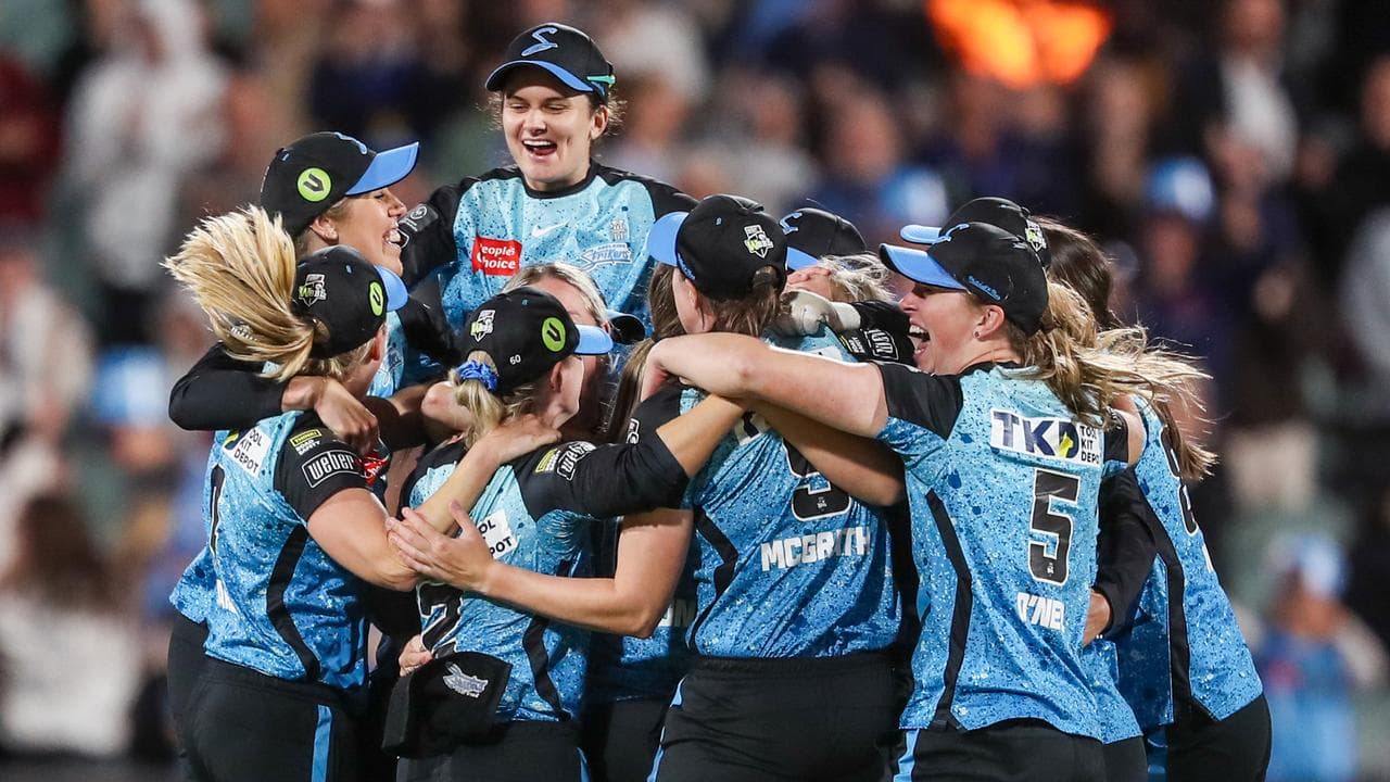 Adelaide Strikers players celebrate.