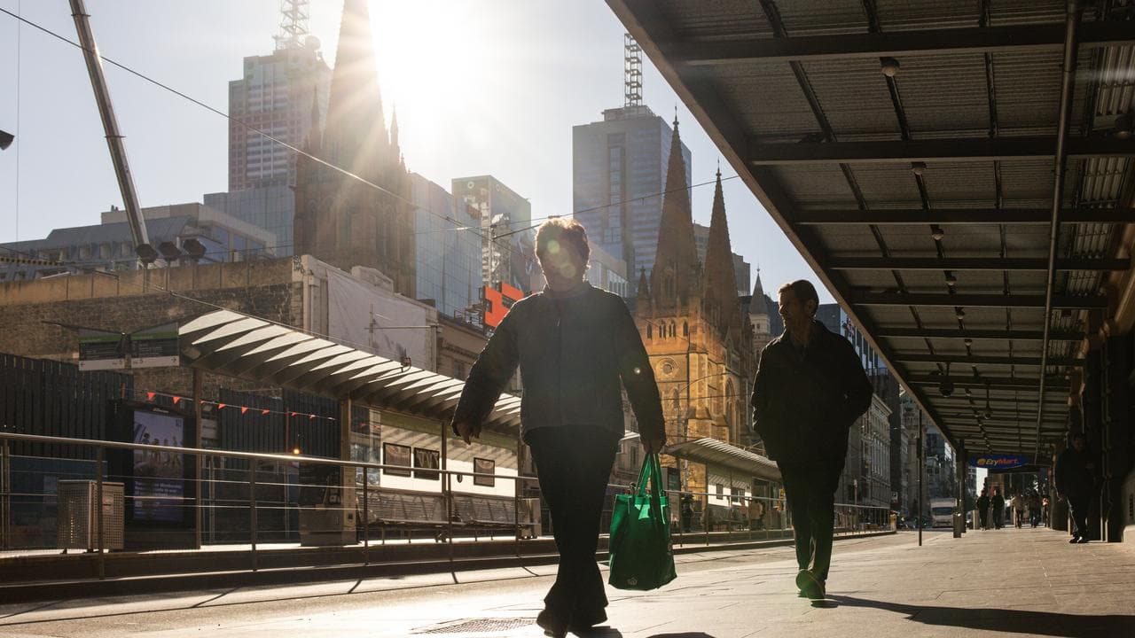 People walk in Melbourne CBD