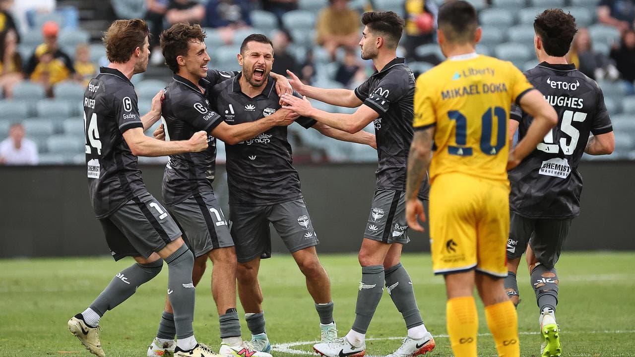 Wellington's Kosta Barbarouses (third left).