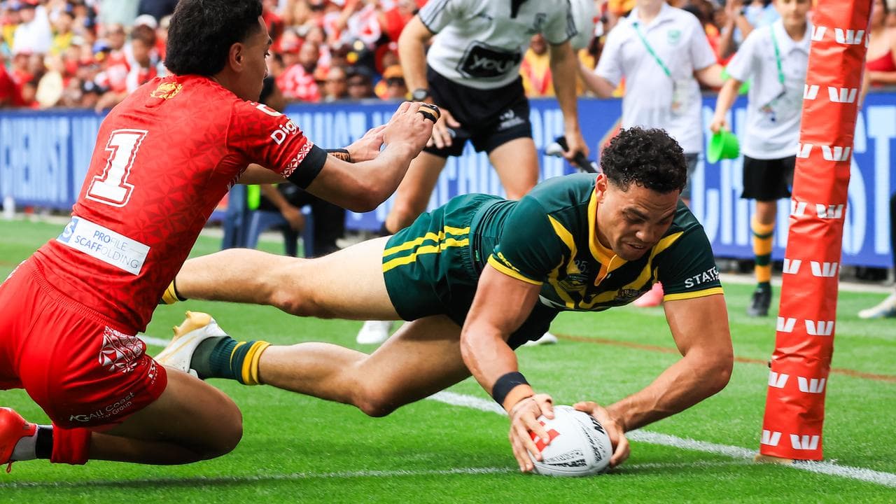 Xavier Coates of the Kangaroos scores a try.