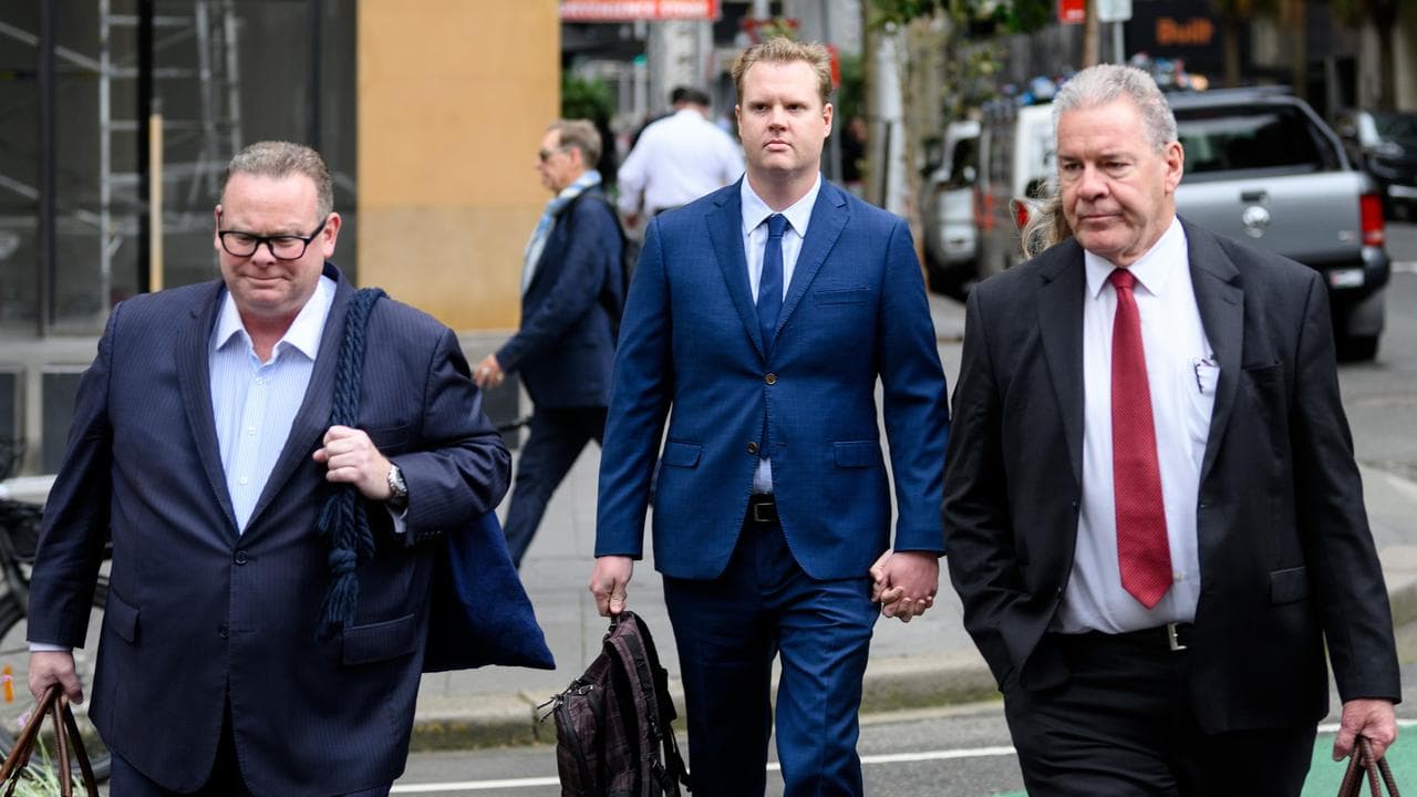 Senior Constable Kristian White walks into the Supreme Court