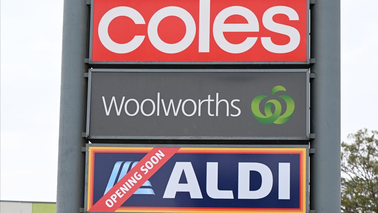 Signage for supermarket companies Coles, Woolworths and Aldi