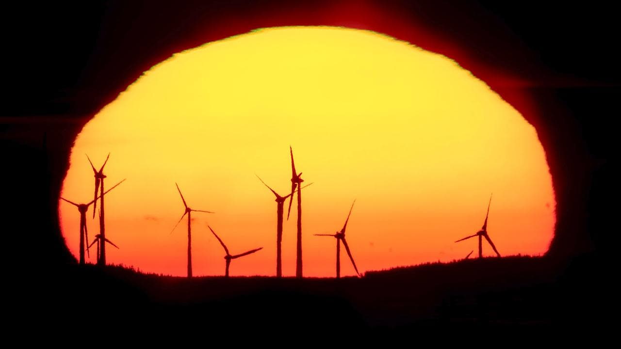 Sunset at a wind energy plant in Germany 