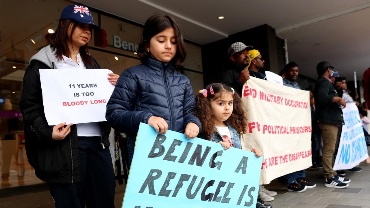 Refugees take part in a protest