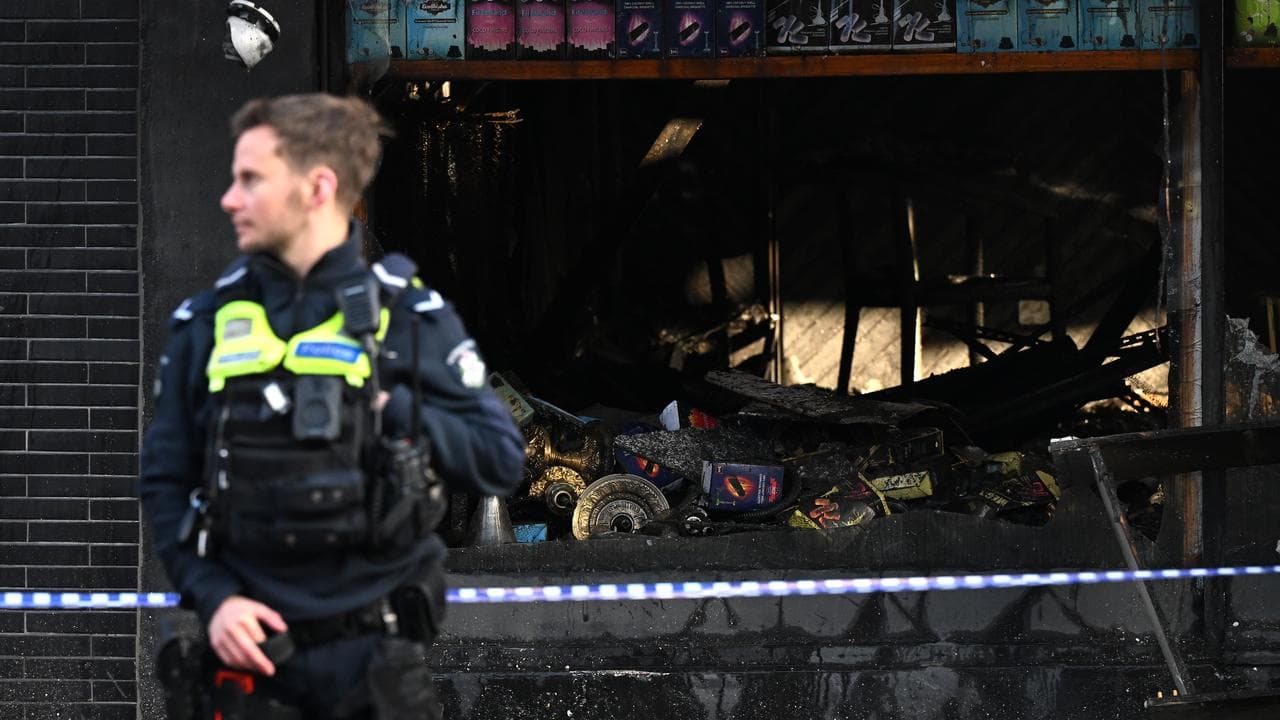 The crime scene of a suspicious fire at a tobacco shop