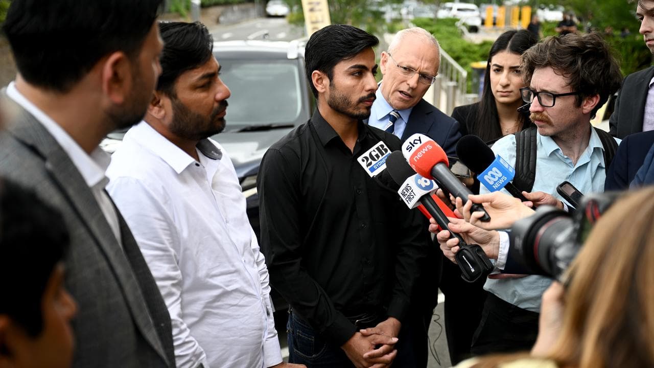 Muzafar Ahmad Tahir (left), and Sheraz Ahmad Tahir (centre),.