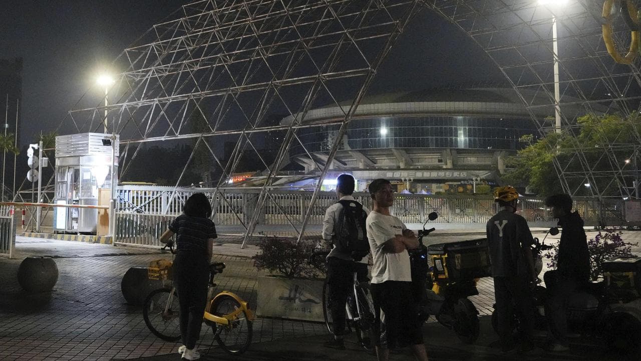 People gather near a sports centre after a crash in Zhuhai, China