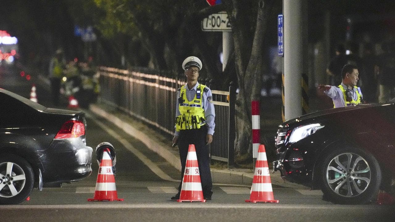 A guard near a sports centre where a man rammed a car into people
