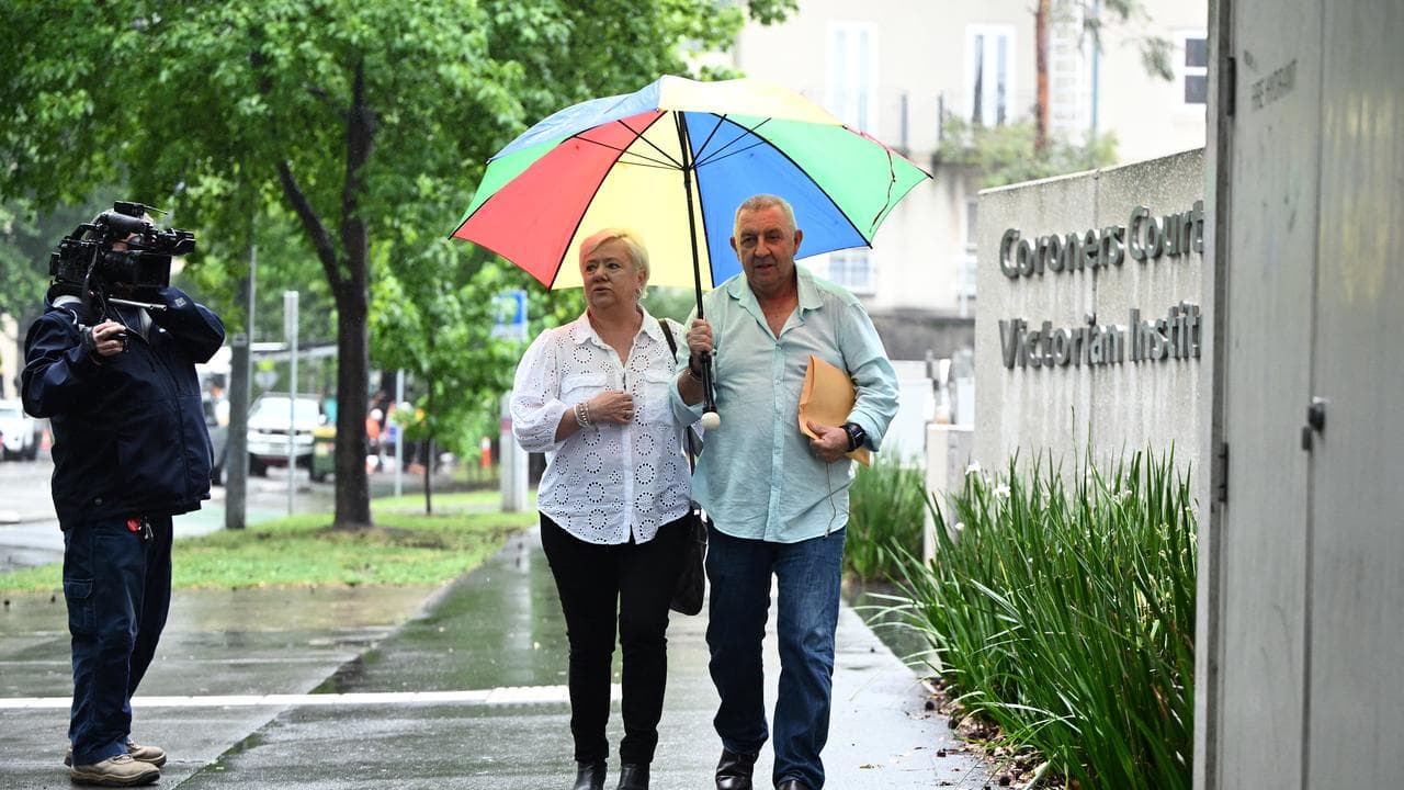 Mal Dalzell (right) and Jenny Dalzell leave the Coroners Court